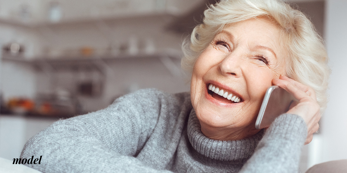 Elderly Model Enjoys a Phone Conversation
